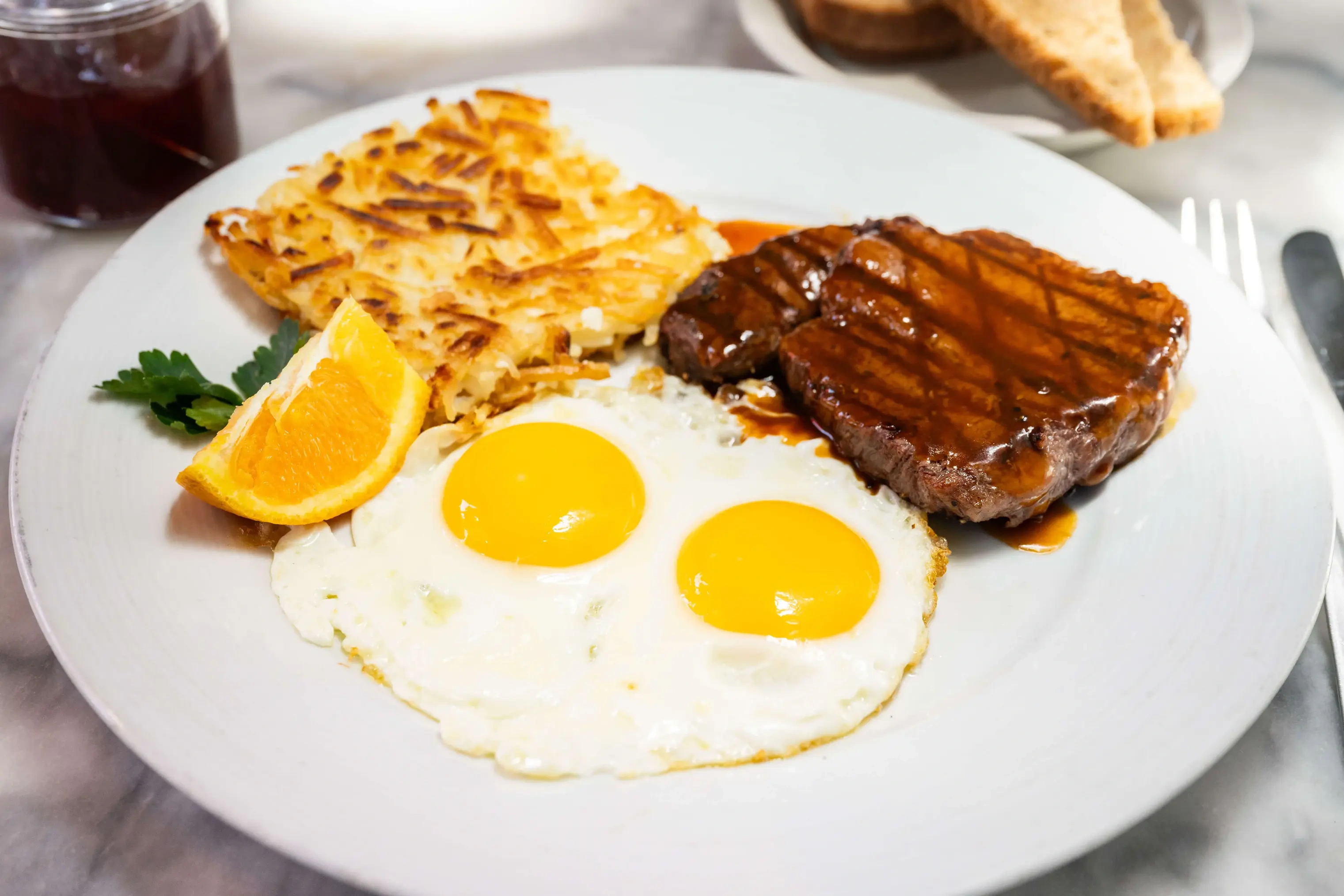 2 Eggs, Hash Browns, Toast + Meat